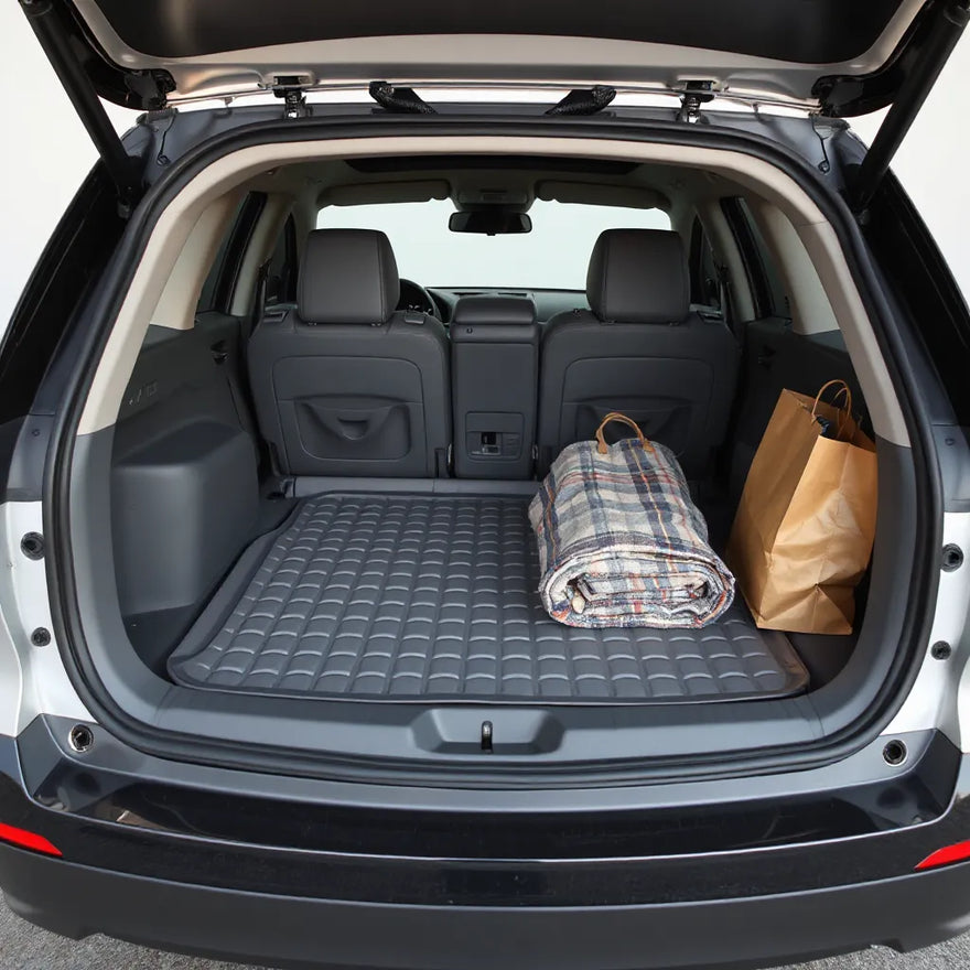 Open car boot with a protective trunk liner and mat keeping the cargo area clean